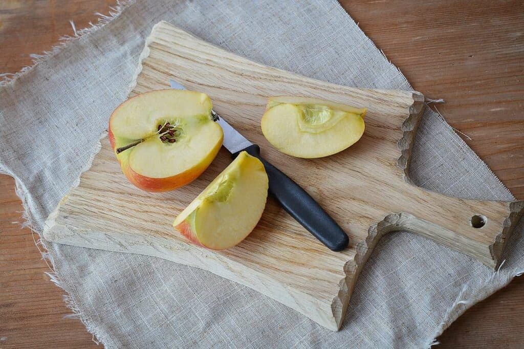 Cut up apple on cutting board
